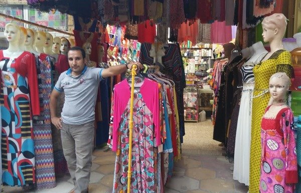 Colourful clothes displayed on mannequins fill Ramadi shops once again. [Saif Ahmed/Diyaruna]
