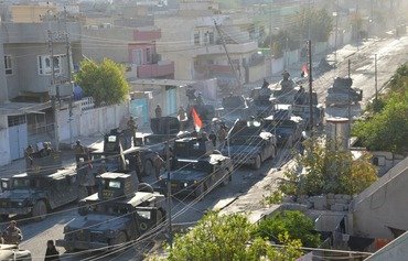 بالصور: القوات العراقية تدخل المناطق المحررة حديثا في الموصل