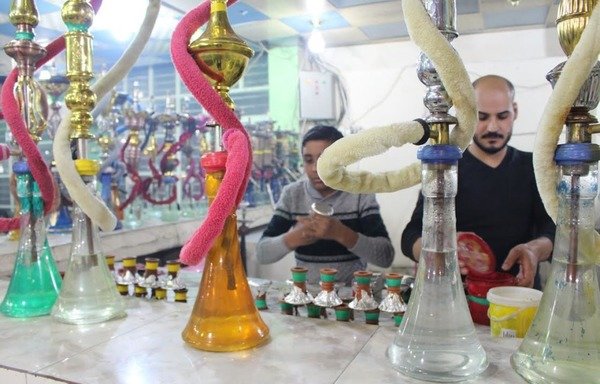 Samir Amis shisha and coffee shop in Fallujah re-opened its doors to customers after more than two years of 'Islamic State of Iraq and the Levant' rule during which the group imposed strict rules on the city, including a ban on smoking. [Saif Ahmed/Diyaruna]