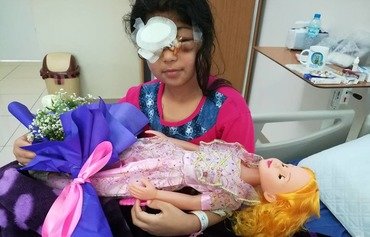 Shot in the face by ISIS, Mosul girl becomes symbol of unity