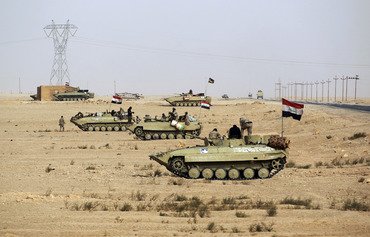 Iraqi forces seize Syria border post from ISIS