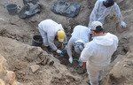 Iraq to exhume all mass graves of ISIS victims