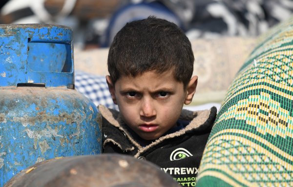An internally-displaced Syrian boy is pictured in a camp in Sarmada in the north of Syria's north-western Idlib province on February 17th. [Rami al-Sayed/AFP]