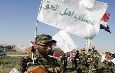 Iraqis call on militias to leave liberated areas