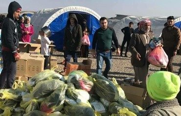 Ninawa network collects bread for Mosul IDPs