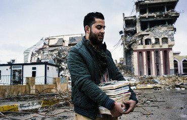 Iraqis donate books to rebuild Mosul libraries