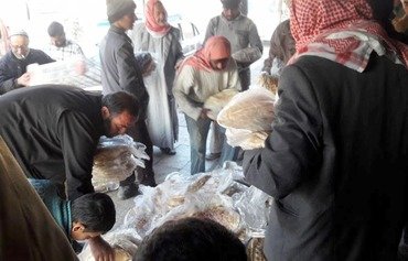 Reopened al-Bab bakery provides relief to city residents