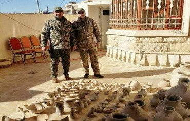 Stolen artefacts retrieved from abandoned home in Mosul