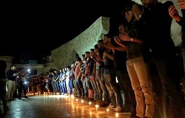 مراسم شمع روشن کردن برای قربانیان اردوگاه اسپایکر