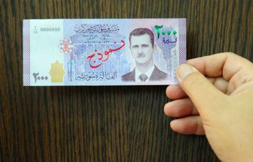 Un billet de banque portant l'image d'al-Assad boycotté
