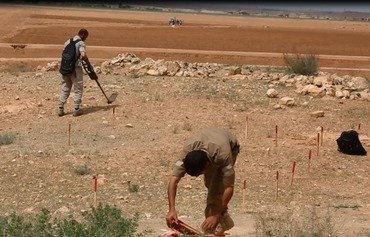 Al-Raqa Civil Council clears mines from liberated areas