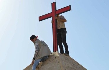 جوانان نینوا کلیساهای ویران شده توسط داعش را بازسازی می کنند