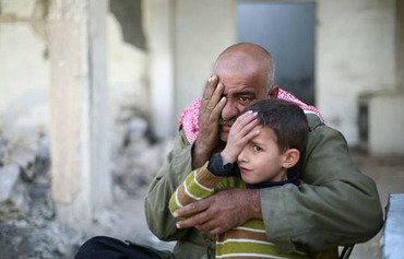 کودک سوری با یک چشم نابینا نشانه محاصره شده است