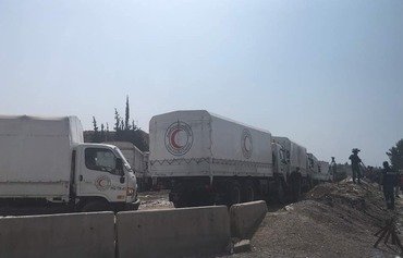 Eastern Ghouta aid delivery cut short by airstrikes