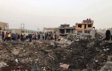 20 قتيلا على الأقل في انفجار مستودع أسلحة في بغداد
