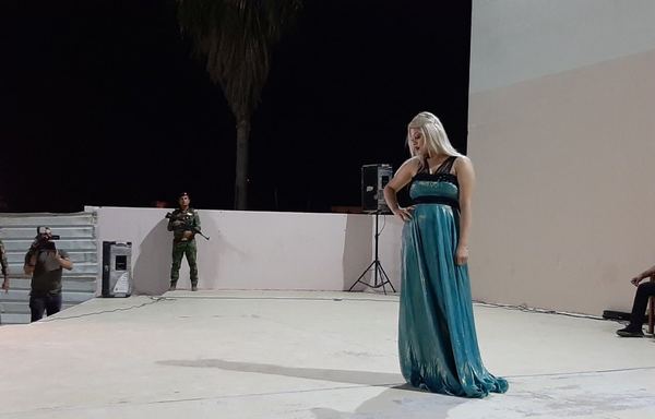 An Iraqi model displays a sweeping sea-green designer gown during an August 18th fashion show at al-Habbaniya's Babylonian Theatre. [Saif Ahmed/Diyaruna]
