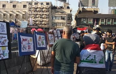 المتظاهرون العراقيون يدينون ʼالسلوك العدائيʻ للميليشيات المدعومة من إيران