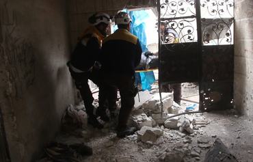 Syria regime fire kills 9 in school turned shelter