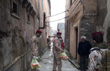 Iraqis extend helping hand to those affected by economic fallout from virus
