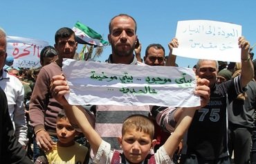 Idlib's displaced agitate for their return home