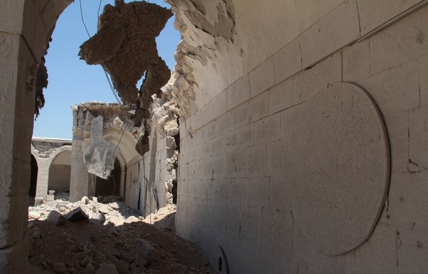 The Ottoman era Murad Pasha caravanserai (Khan Murad Pasha), which dates back to 1565 and serves as a museum with a collection of ancient artefacts and mosaics, is seen partially destroyed in the Idlib province city of Maaret al-Numan on June 16, 2015, following reported airstrikes by Syrian regime forces. [AFP Photo/Al-Maaraa Today/Ghaith Omran]