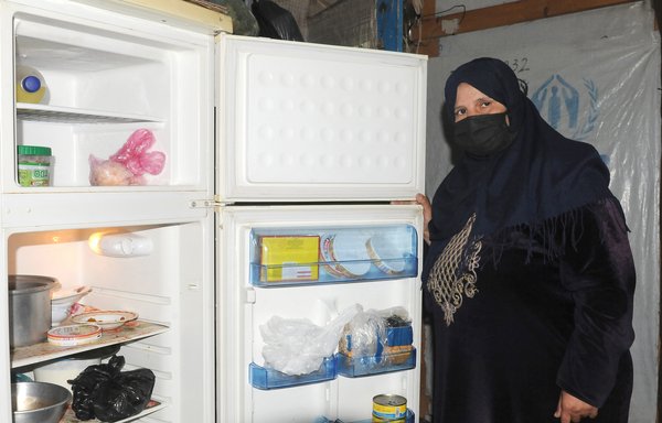 Refugee Shama al-Hadid said the contents of her refrigerator do not reflect how Ramadan iftars used to be in the past, when she used to prepare multiple meat-based dishes. [Ziad Hatem/Al-Mashareq]