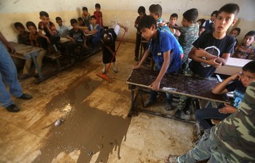 صفقة الصين لبناء ألف مدرسة في العراق تثير مخاوف بشأن عواقب طويلة المدى