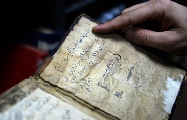Mosul library ISIS looted, burned, is set to reopen
