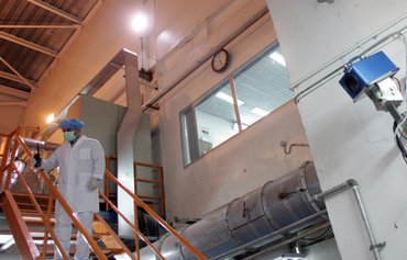 Iran disconnects nuclear site cameras, plans to enrich more uranium after censure
