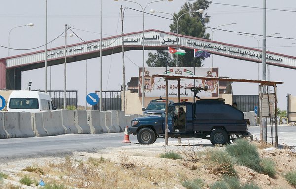 Jordanian troops guard the closed Jaber/Nassib border post at the kingdom's border with Syria last August 1. [Khalil Mazraawi/AFP]