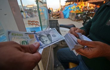 اعمال ممنوعیت علیه ١٤ بانک عراقی توسط ایالات متحده به‌منظور جلوگیری از تجارت دلاری با ایران